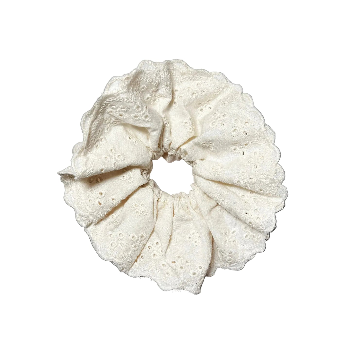 White textured scrunchie on a black background