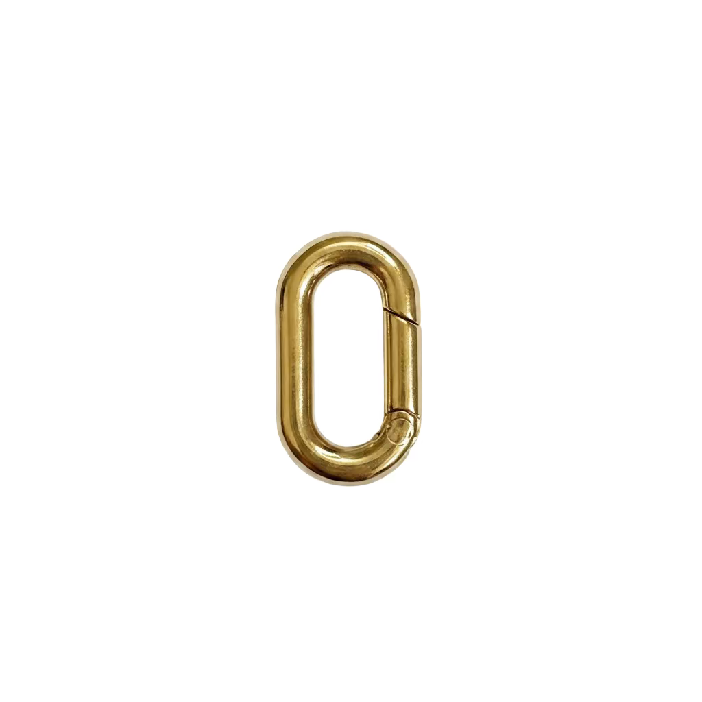 Gold metal clip on a textured white background