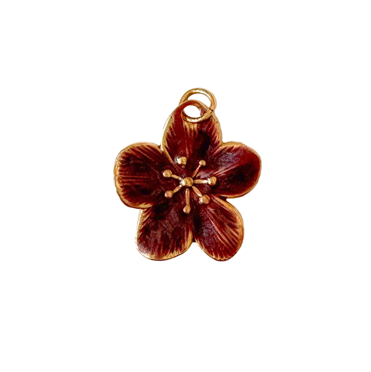 Bronze flower-shaped pendant on a white background