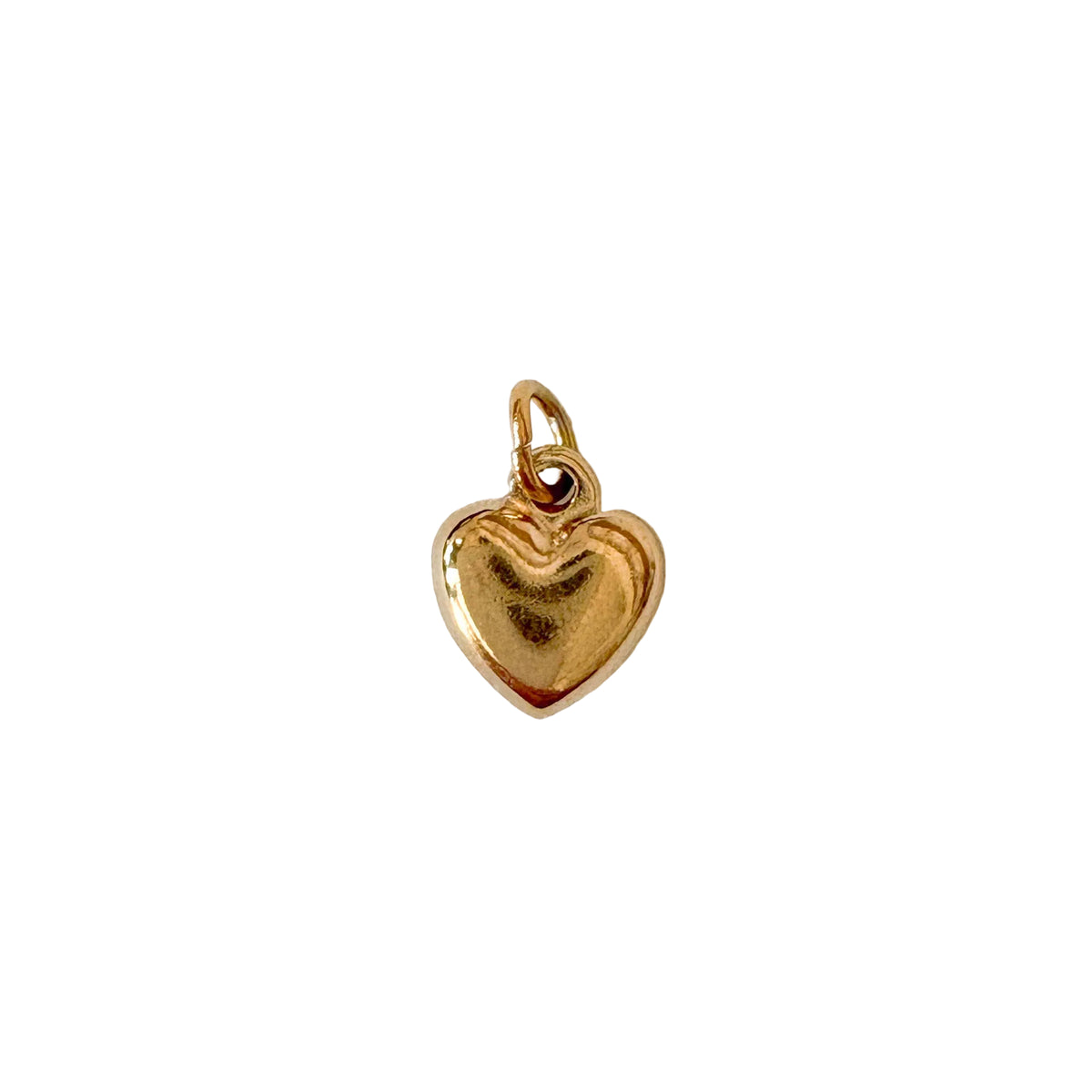 Gold heart-shaped pendant on a white background