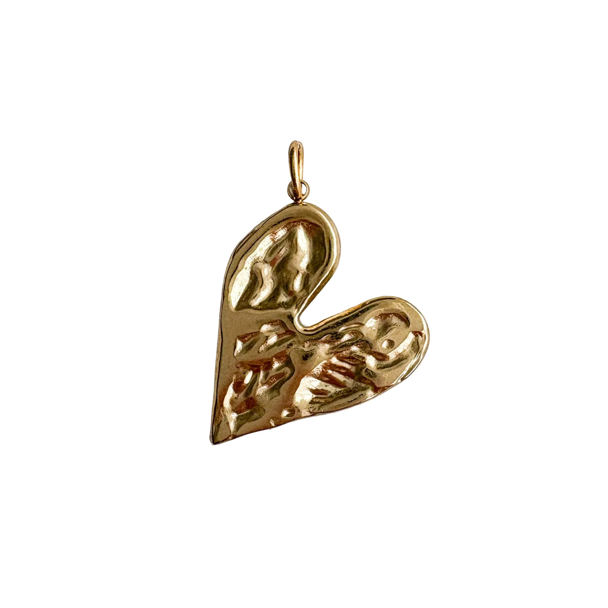 Gold heart-shaped pendant on a light gray background