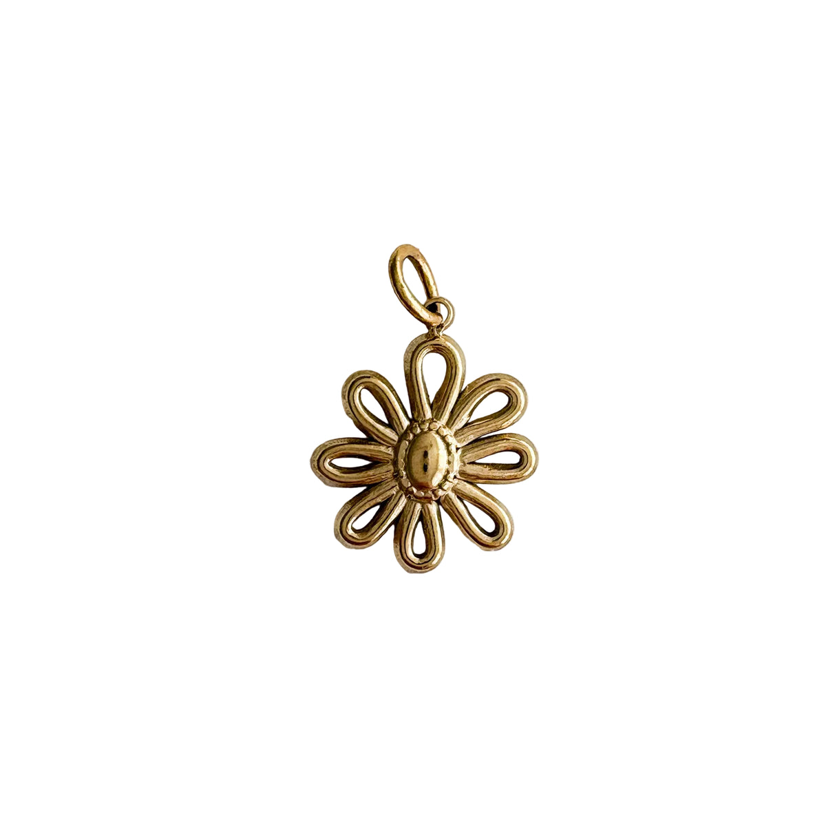 Gold flower-shaped pendant on a light gray background