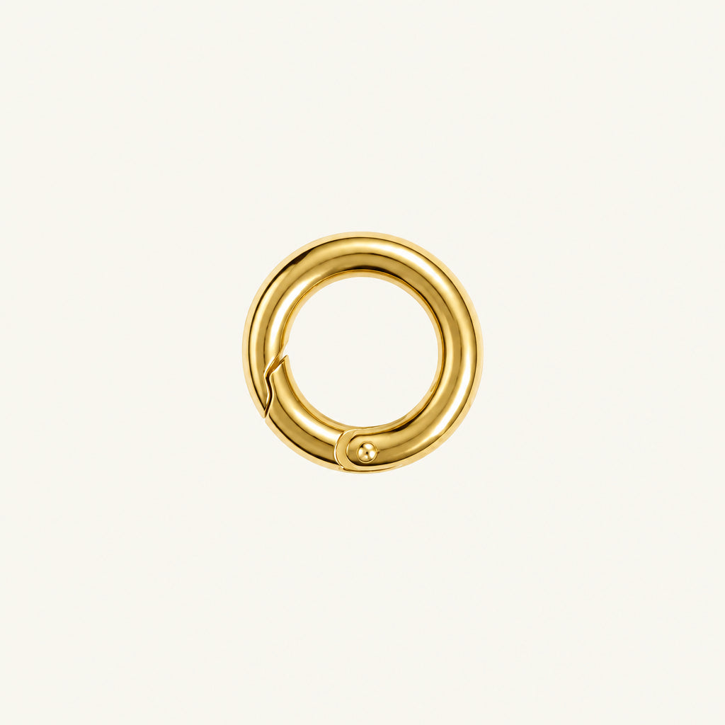 A small gold-colored metal ring clasp or connector with a polished finish, shown on a plain white background.