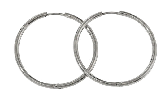 Two silver hoop earrings on a white background